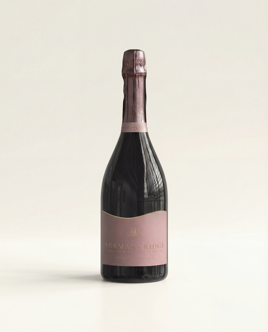 Bottle of Norman's Ridge wine on a beige background