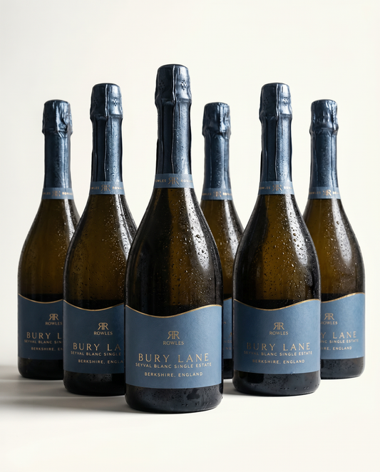 Six bottles of Bury Lane sparkling wine on a white background